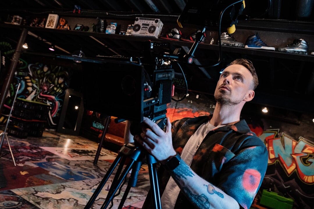 Camera operator filming a live television broadcast in a studio