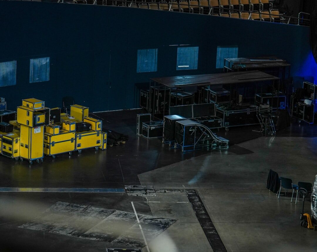 Television studio with cameras, lighting rigs and a control room window